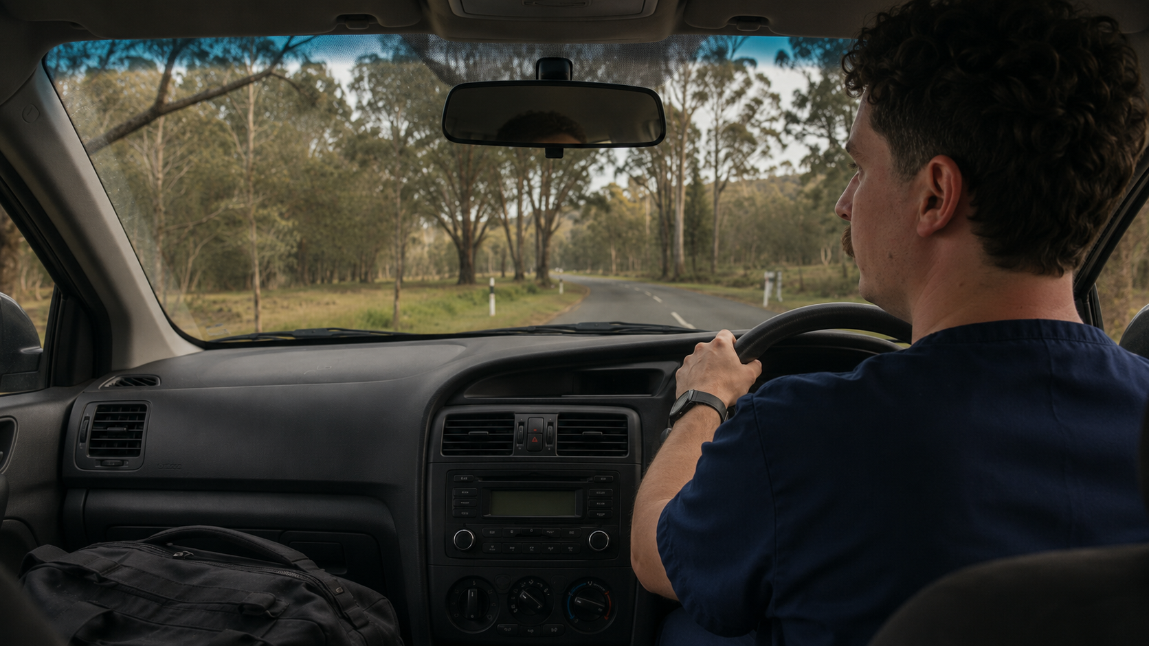 Driving through a rural Tasmanian road for a mobile nursing visit